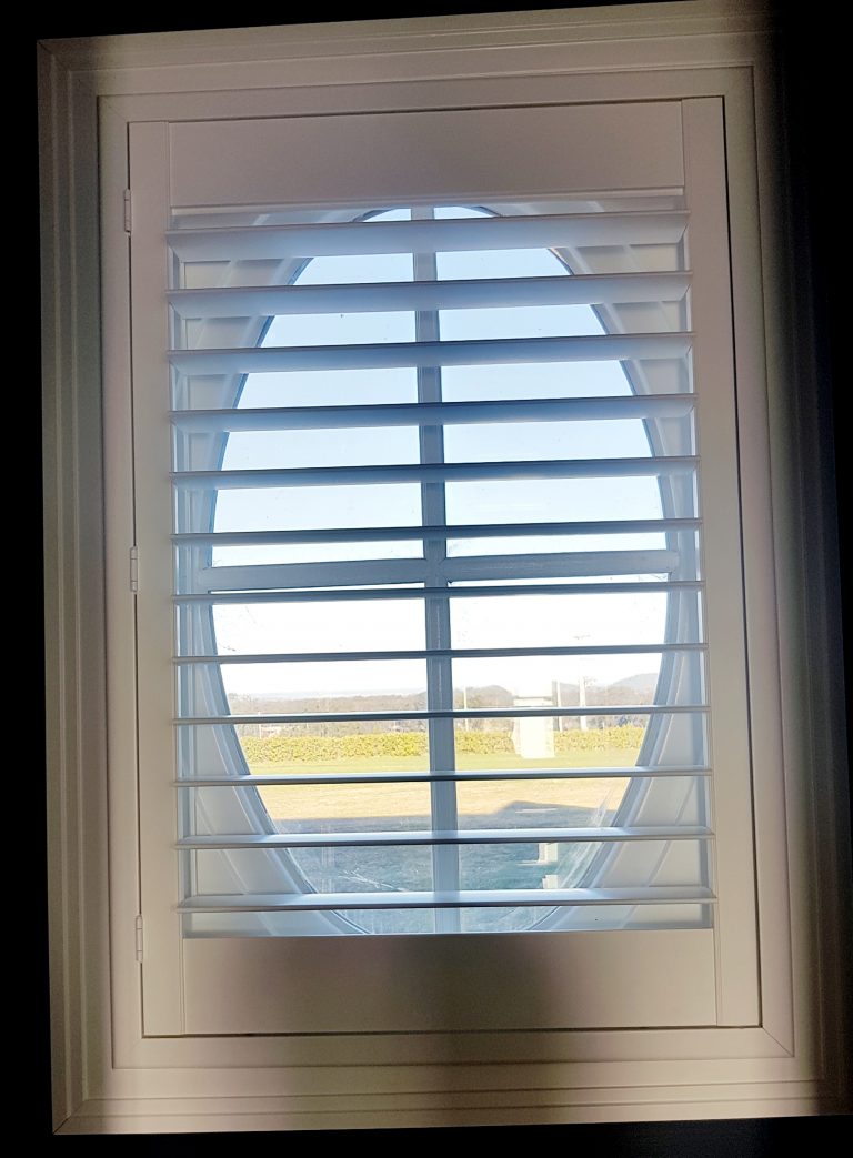 An oval window with a view of outside