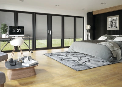 large bedroom with grey furnishings