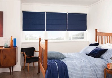 navy horizontal roller blinds in a bedroom