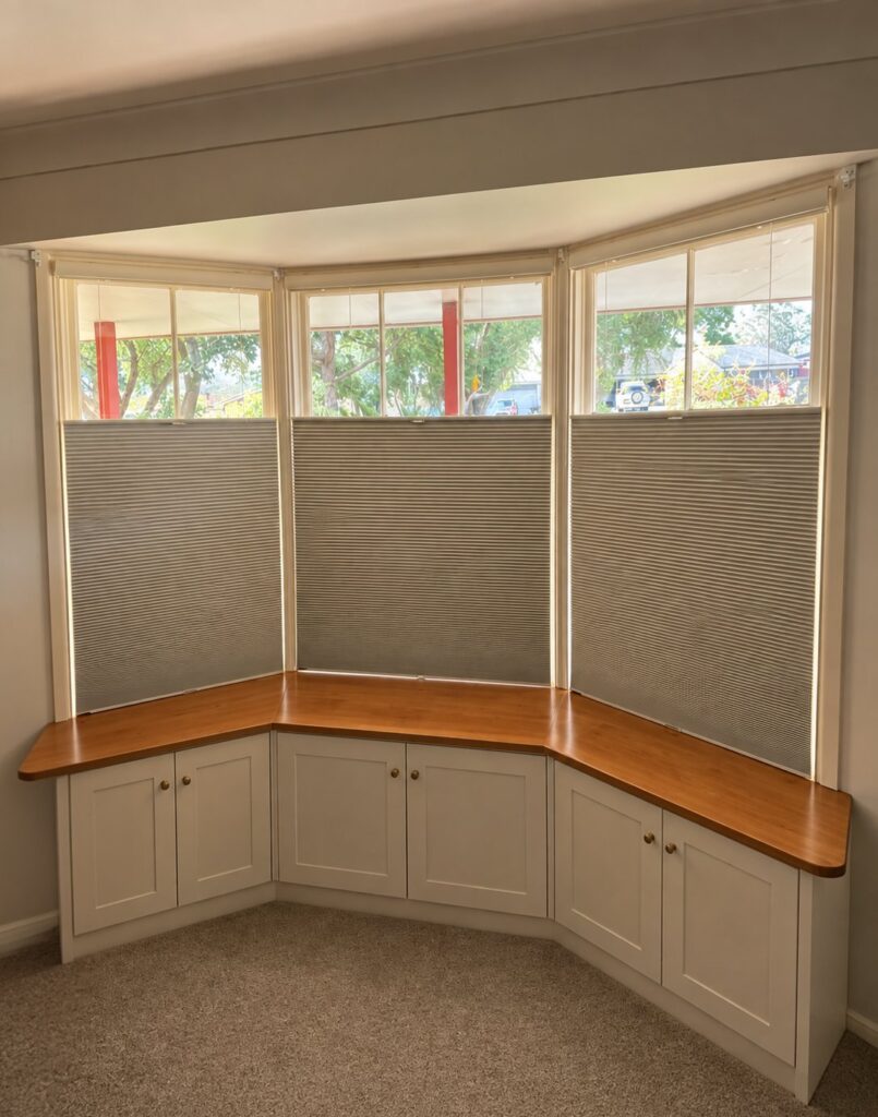Top-down bottom-up honeycomb blinds in a bay window