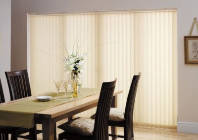 white vertical blinds in a dining area