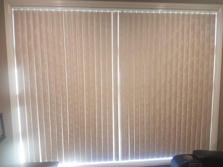 Pair of patterned PVC vertical blinds fully closed