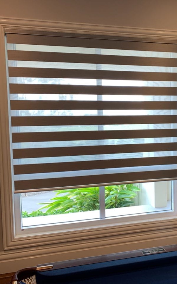 Zebra blind with sheer and solid stripes on a large window